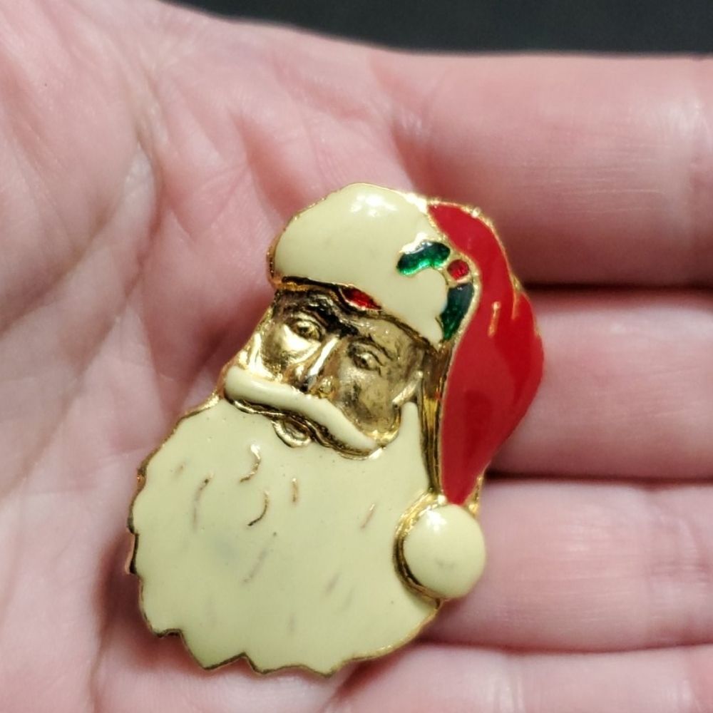 Vintage gold tone holiday santa brooch